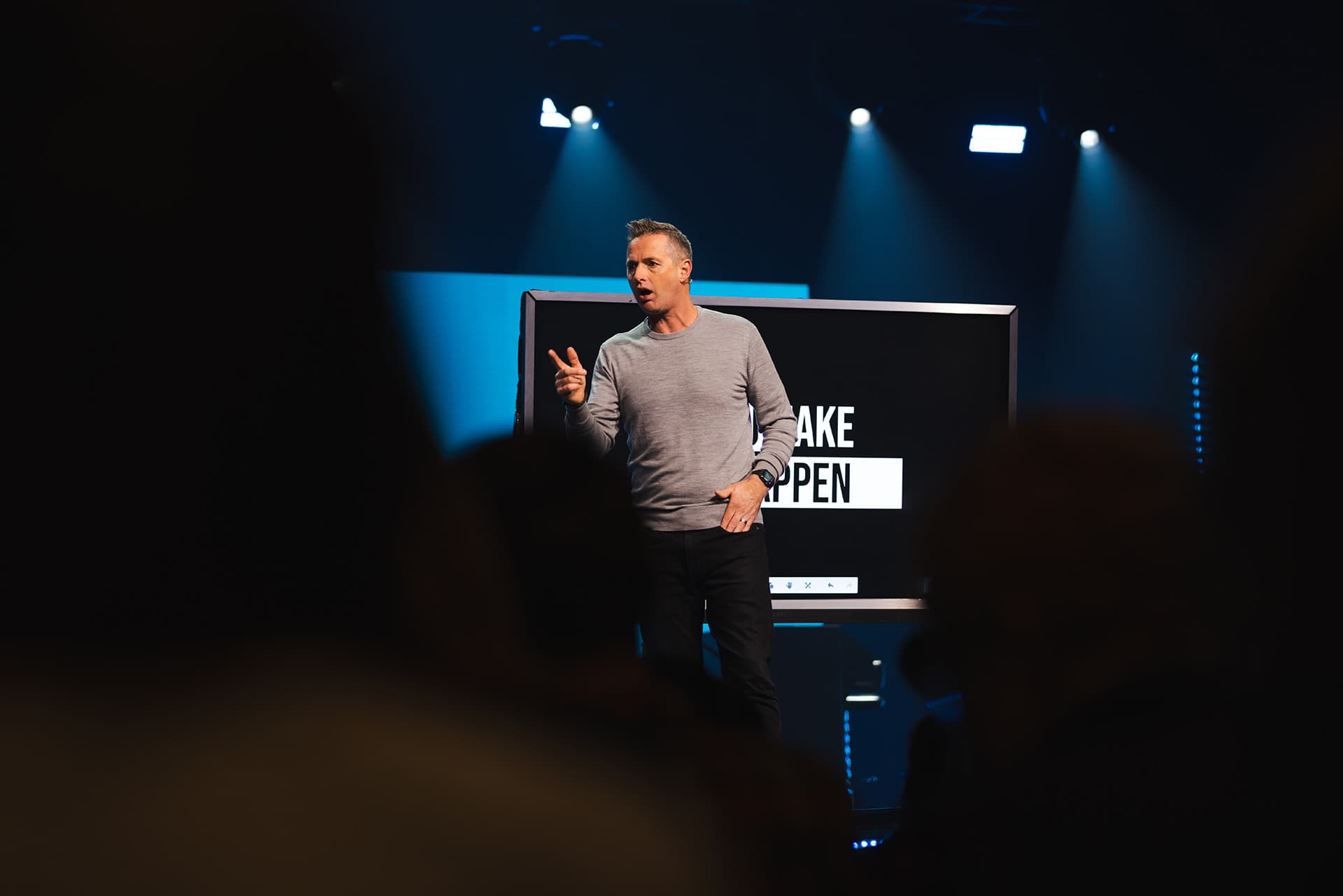 Andrew McCourt speaking at an event